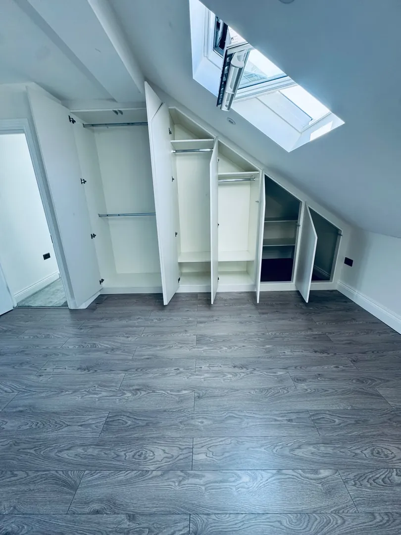 Before: Awkward loft eaves turned into a seamless fitted wardrobe