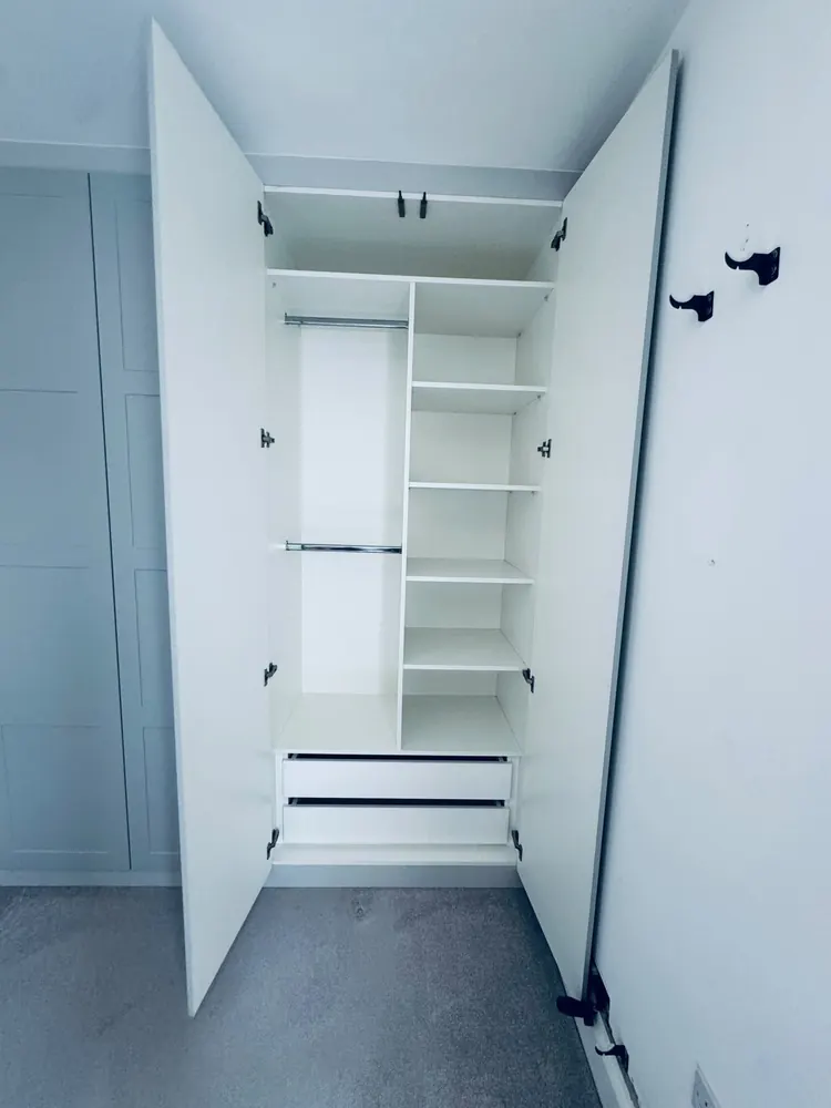 Walk-in wardrobe with hanging rails and drawers